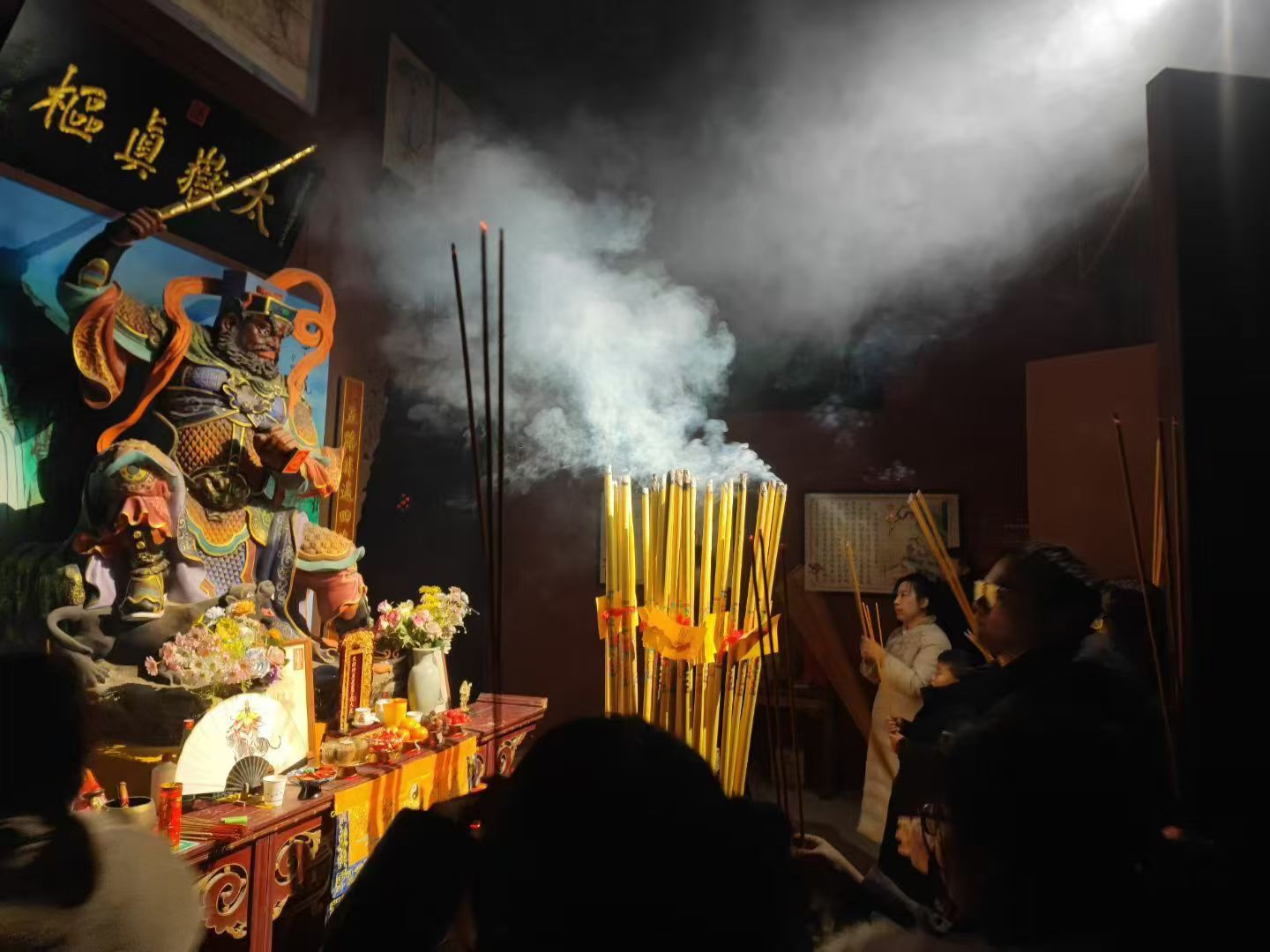 Incense and light inside a Taoist temple